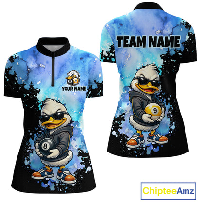 Front and back views of a women's short-sleeve polo shirt with a cartoon duck wearing sunglasses and holding pool balls, on a blue and black splattered background. The front has a half-zip collar and customizable text/logo area, and the back has 'TEAM NAME' printed across the shoulders.