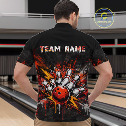 A man viewed from behind wearing a black short-sleeve bowling-themed shirt with a large graphic of a bowling ball and pins, plus the text 'TEAM NAME' on the back, standing in a bowling alley.