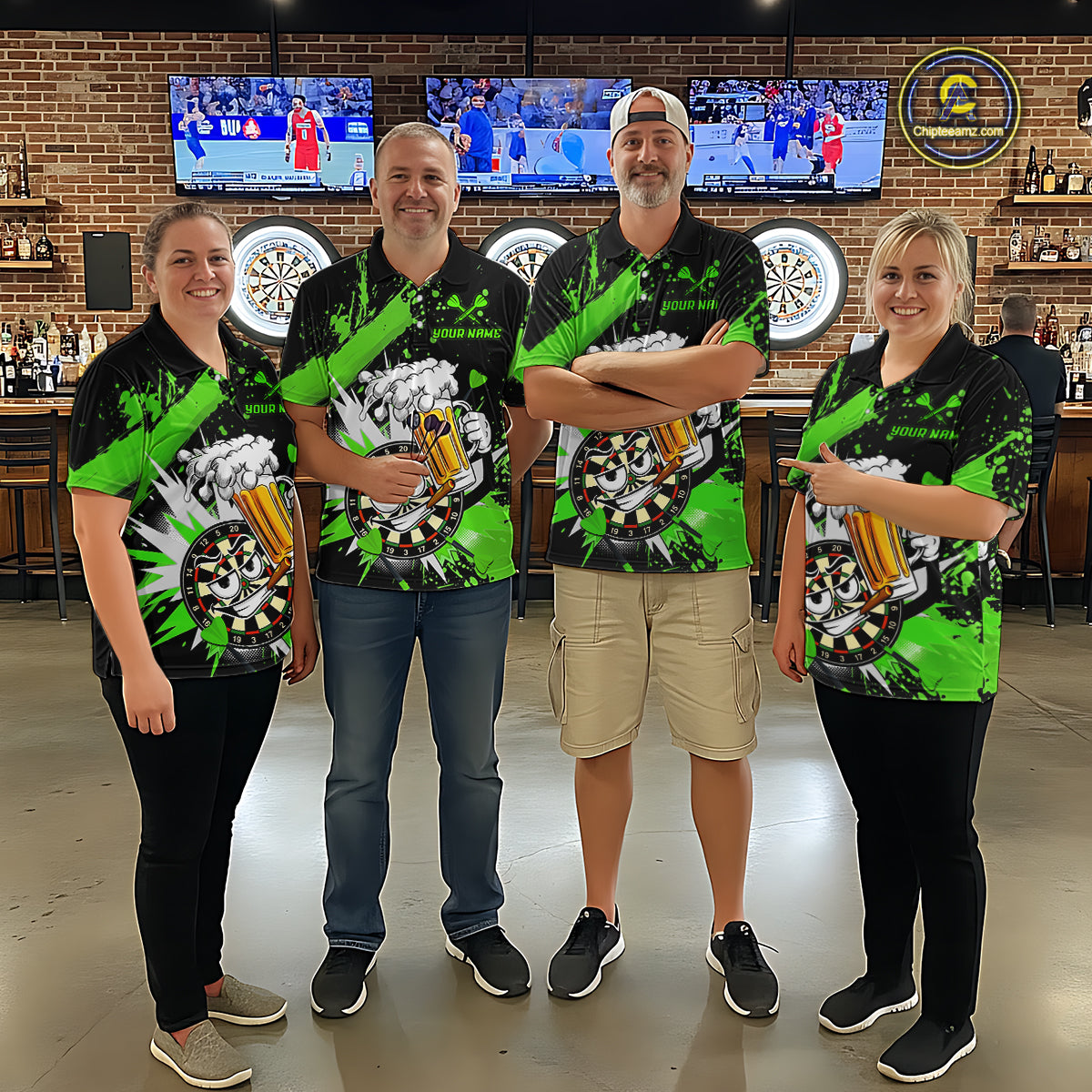 Four people standing together in a bar or lounge setting, wearing matching black and neon green graphic shirts with a large circular dialysis-themed print on the front.