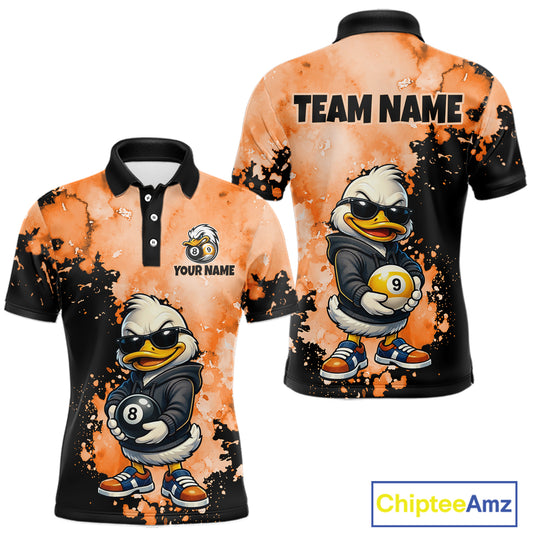 Front and back views of a custom short-sleeve polo shirt featuring a cartoon duck mascot wearing sunglasses and holding billiard balls, with orange splatter-style graphics and black collar. The back shows 'TEAM NAME' and 'YOUR NAME' text placeholders.