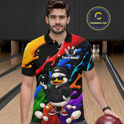 A man wearing a colorful bowling-themed custom polo shirt with a cartoon duck character graphic, standing in a bowling alley holding a bowling ball. 