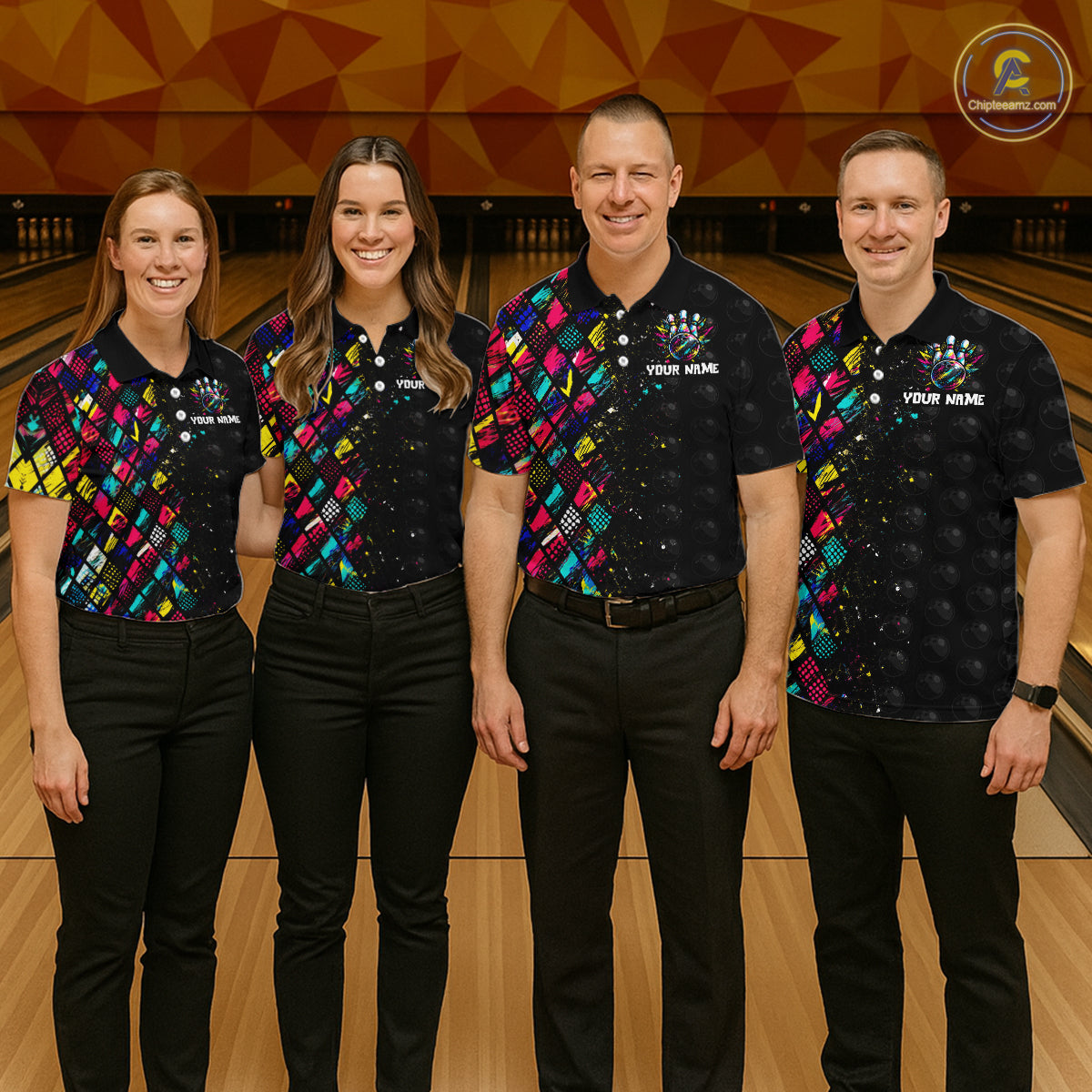 Four people in matching bowling shirts standing on a bowling alley.