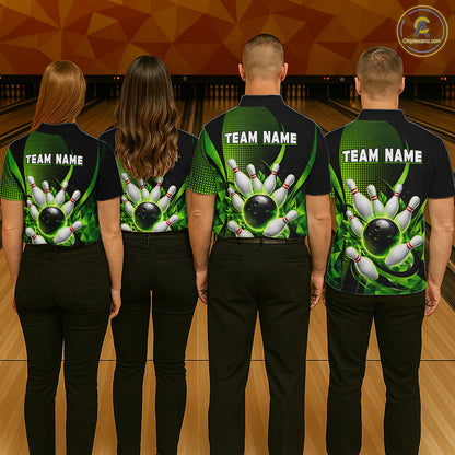 Four people wearing bowling team shirts with a green and black design on a bowling alley.