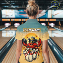 Load image into Gallery viewer, Person wearing a shirt with a colorful design of a crab bowling at a bowling alley.