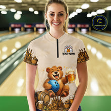 Load image into Gallery viewer, Woman wearing a custom bowling shirt with a bear design in a bowling alley.