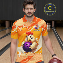 Load image into Gallery viewer, Man wearing a bowling shirt with a chicken holding a ball design in a bowling alley.