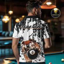 Load image into Gallery viewer, Man wearing a shirt with a dog holding a pool ball design in a bar setting.