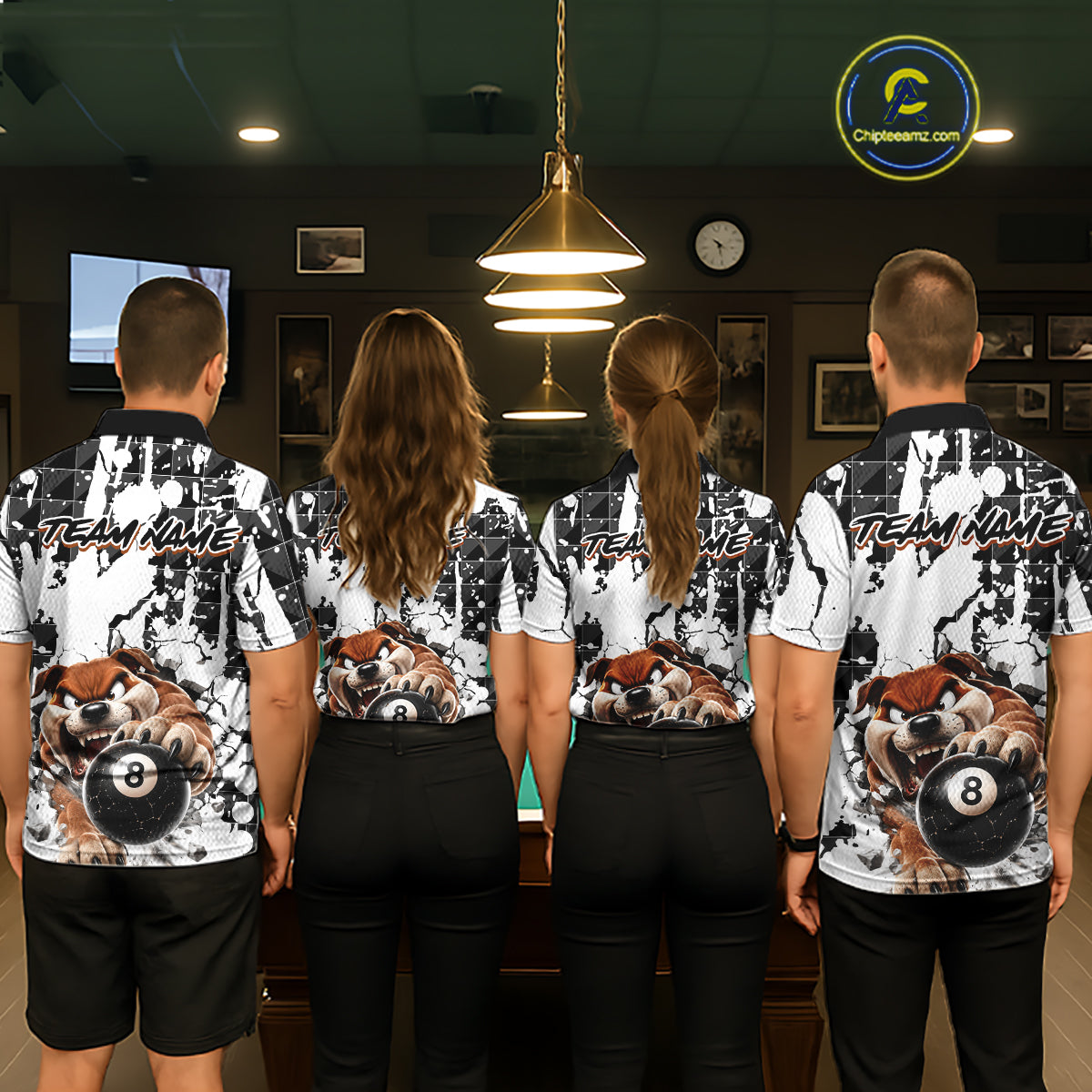 Four people wearing matching shirts with a bear and pool ball design in a room.
