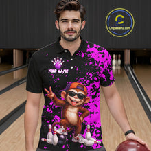 Load image into Gallery viewer, A man wearing a black and bright purple bowling-themed graphic polo shirt with a cartoon monkey design, standing in a bowling alley. The shirt features a purple bowling pin graphic, the text 'YOUR NAME'  and a purple splatter pattern.