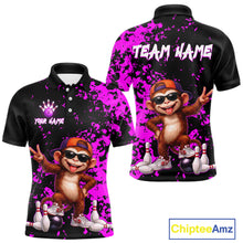 Load image into Gallery viewer, Customizable black short-sleeve polo shirt with a bright purple paint splatter design, featuring a cartoon monkey wearing sunglasses and an orange cap, bowling pins, and bowling balls. The front shows a white placeholder logo and text, displaying Your Name and Team Name