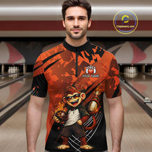 Load image into Gallery viewer, A man wearing a short-sleeve bowling jersey with a bold orange and black graphic design featuring a cartoon monkey holding bowling balls. The jersey has a black collar and the text 'YOUR NAME' with a paw print logo on the chest.