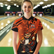 Load image into Gallery viewer, A woman standing in a bowling alley wearing a custom-designed orange and black bowling shirt with a cartoon monkey graphic and 'YOUR NAME' text. 