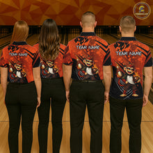 Load image into Gallery viewer, Four people standing with their backs to the camera in a bowling alley, wearing matching custom bowling shirts with a cartoon monkey graphic and 'TEAM NAME' text. The shirts are orange and black with black patterns.