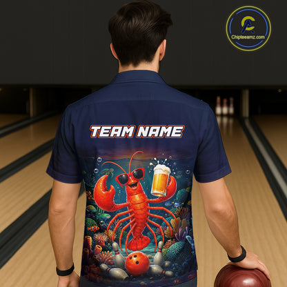 Person wearing a navy blue shirt with a colorful lobster graphic and 'TEAM NAME' text at a bowling alley.