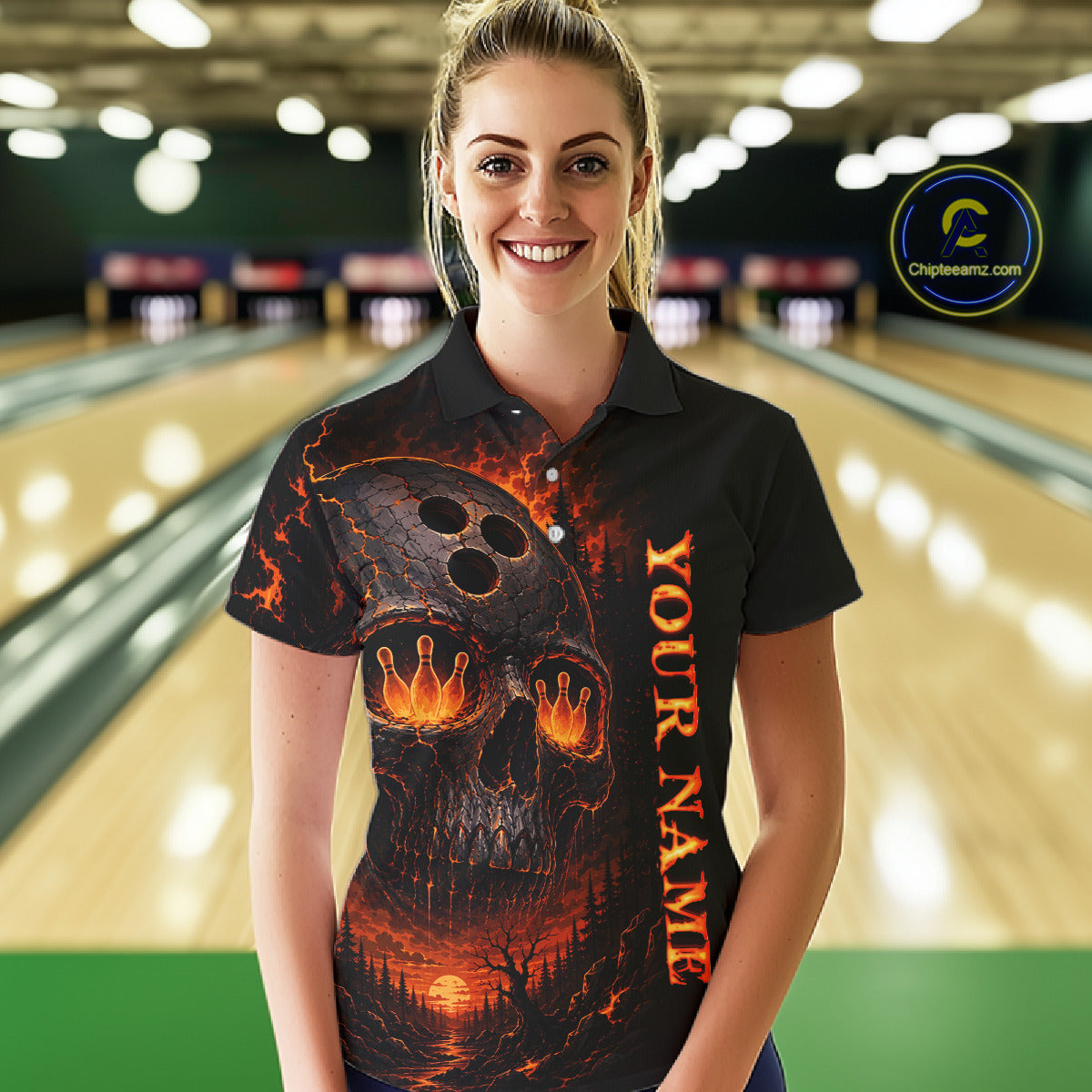 Woman wearing a black bowling shirt with a fiery design and 'Your Name' text in a bowling alley.