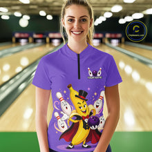 Load image into Gallery viewer, Person wearing a purple bowling shirt with cartoon characters in a bowling alley.
