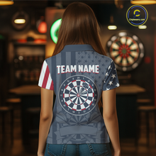 Load image into Gallery viewer, Back view of a female model showing off a retro style custom darts shirt with a large dartboard and red 'TEAM NAME' printed across the shoulders.