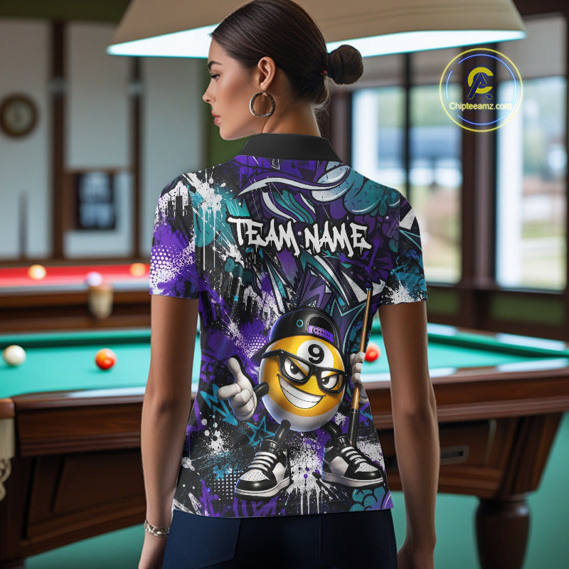 Person wearing a colorful polo shirt with a billiard ball design in a pool hall.