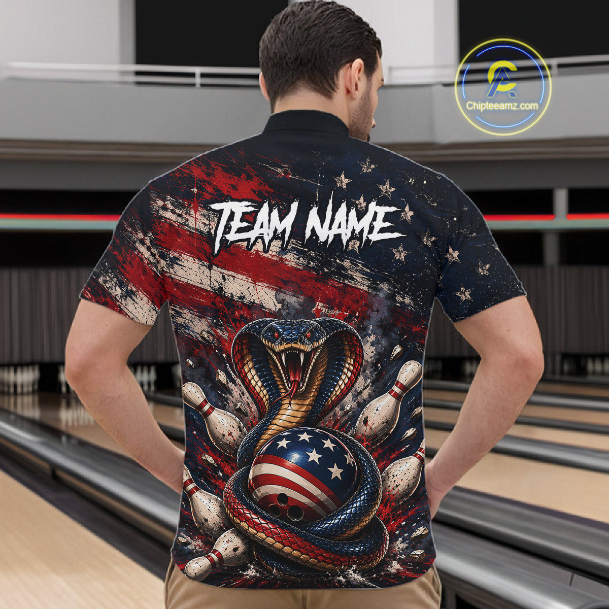 Man wearing a bowling-themed shirt with an American flag design in a bowling alley.