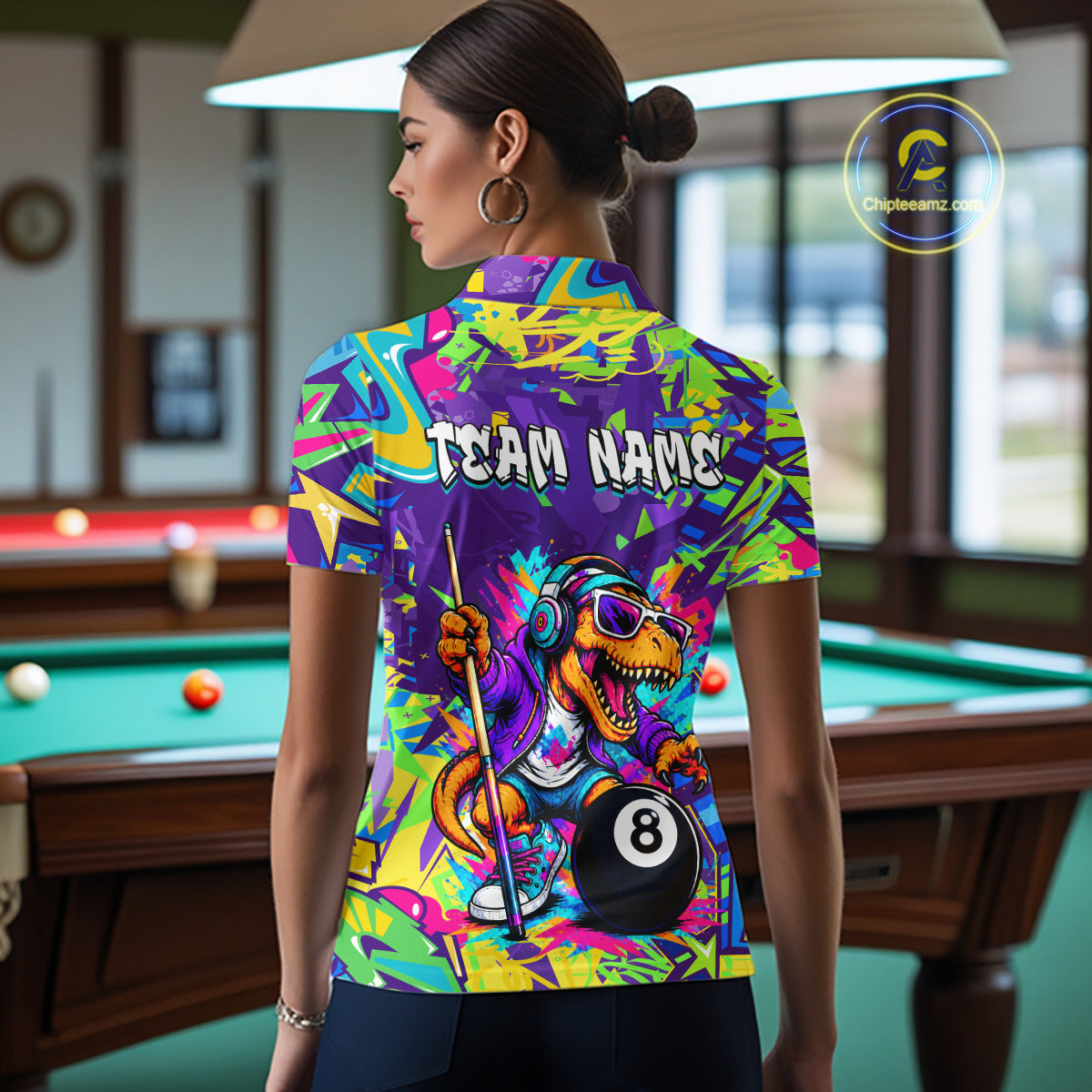 Person wearing a colorful polo shirt with a dinosaur design and 'Team Name' text in a pool hall.