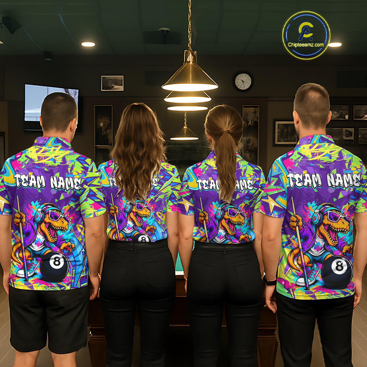Four people wearing colorful team jerseys with a dinosaur and pool ball design in a room.