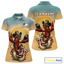 Load image into Gallery viewer, Polo shirt with a crawfish wearing a cowboy hat design on a beige and blue background, featuring 'Chiptee Amz' branding.