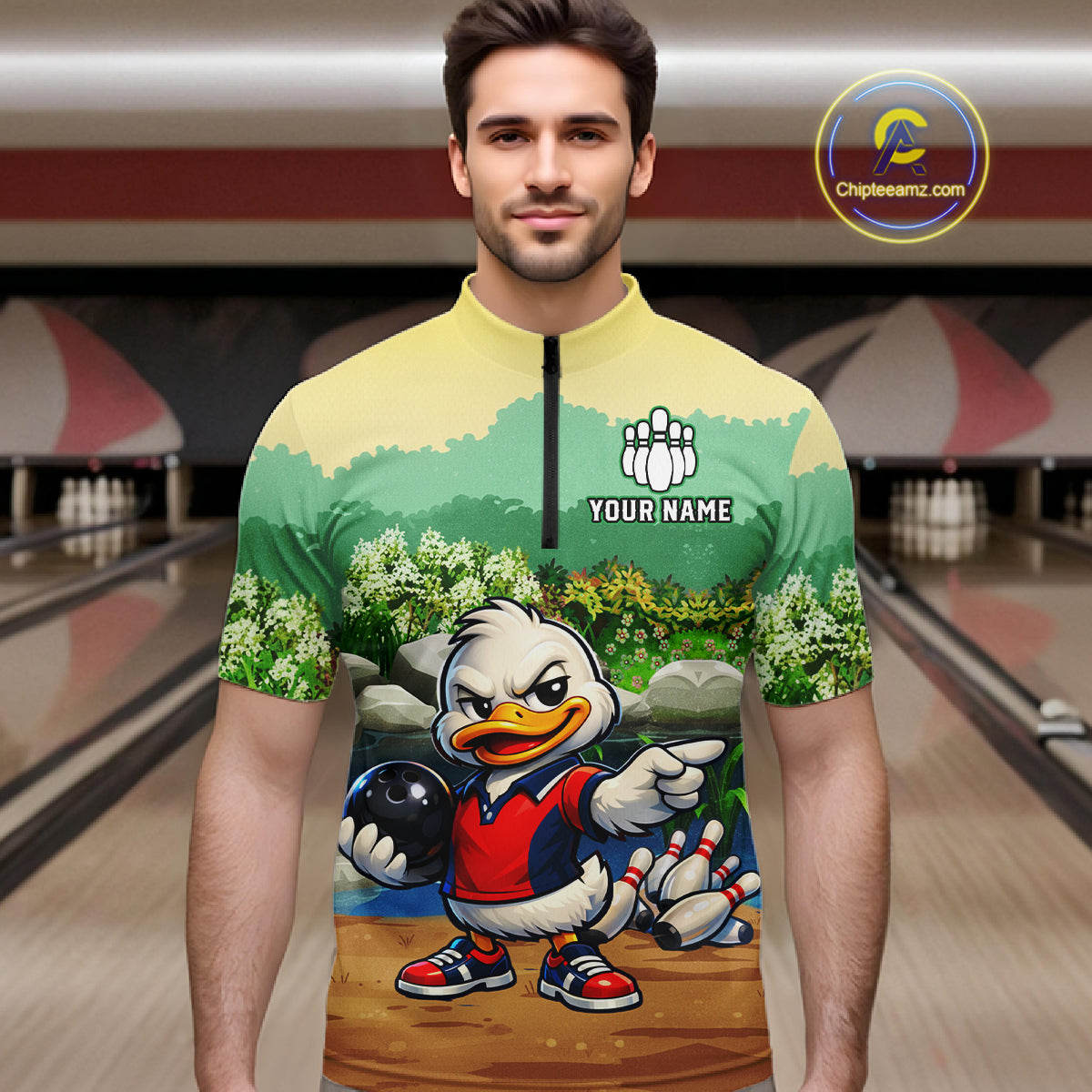 Man wearing a colorful bowling jersey with a cartoon duck design in a bowling alley.