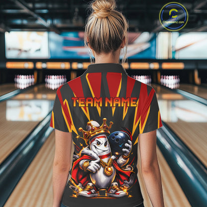 Person wearing a bowling-themed shirt with 'Team Name' text in a bowling alley.
