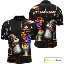 Load image into Gallery viewer, A black short-sleeve polo shirt shown from both front and back, featuring a colorful printed design of an opossum wearing a cowboy hat and scarf beside a rainbow bowling ball on a stand, with customizable text placeholders 'TEAM NAME' and 'YOUR NAME'.