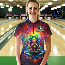 Load image into Gallery viewer, Female model wearing a custom zen frog bowling quarter-zip shirt front view featuring a vibrant neon frog, bowling ball, glowing cosmic background and colorful psychedelic pattern at the bowling alley
