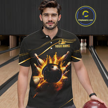 Load image into Gallery viewer, Man wearing custom black gold bowling polo shirt front view featuring a fiery bowling ball and flame burst effect, displaying Your Name, at the bowling alley