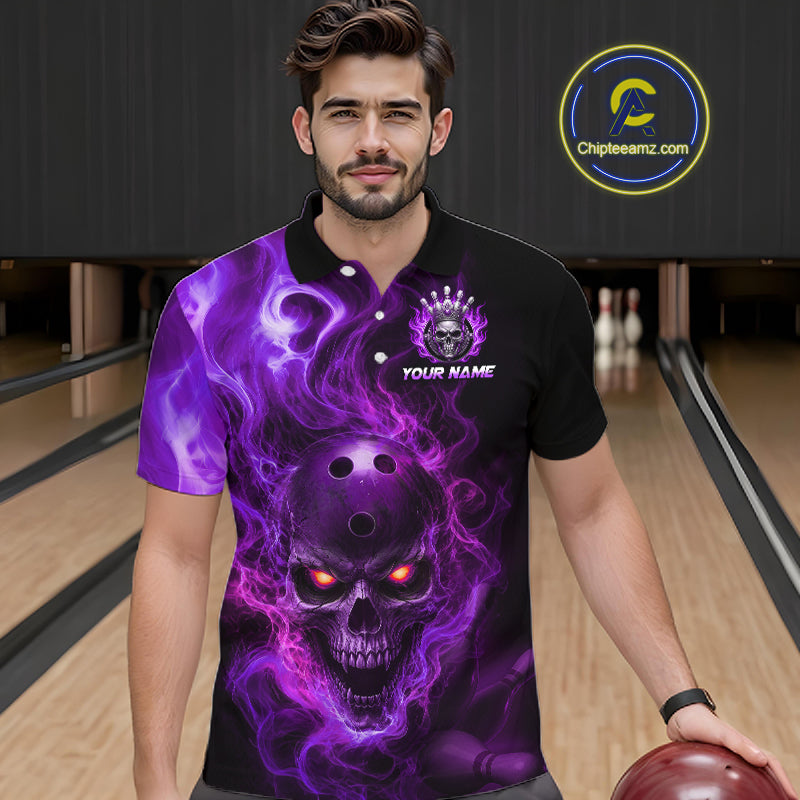 Man wearing a black bowling polo shirt featuring a flaming skull with glowing orange eyes, purple smoke effects, and custom “YOUR NAME” text.
