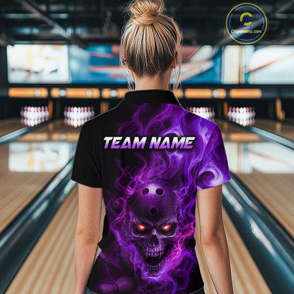 Woman wearing a black bowling quarter zip shirt featuring a flaming skull with glowing orange eyes, purple smoke effects, and custom “TEAM NAME” text