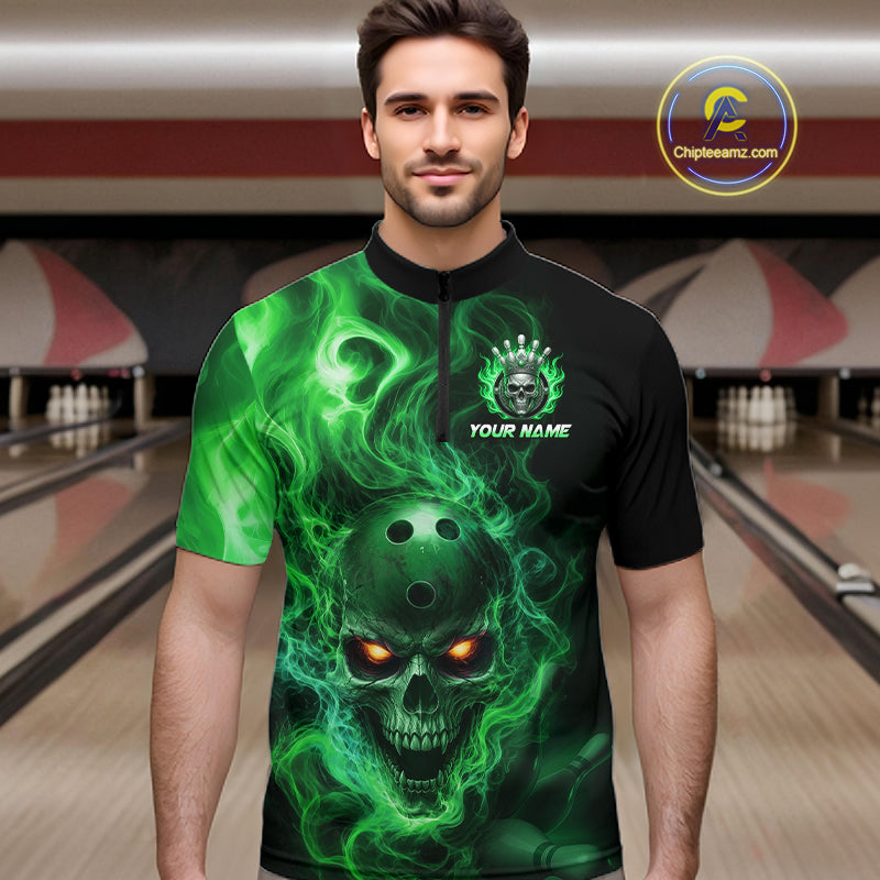 Man wearing a black bowling quarter zip shirt featuring a flaming skull with glowing orange eyes, green smoke effects, and custom “YOUR NAME” text.
