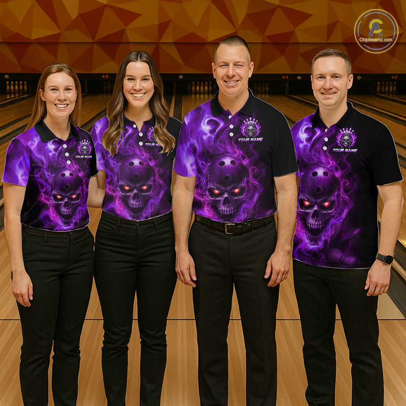 Four people wearing a black bowling polo shirt featuring a flaming skull with glowing orange eyes, purple smoke effects, and custom “YOUR NAME” text