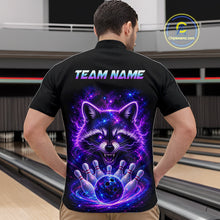 Load image into Gallery viewer, A man viewed from behind wearing a black short-sleeve bowling shirt with a large colorful back graphic of a glowing raccoon and bowling pins, with the text 'TEAM NAME' across the upper back. Bowling lanes are visible in the background, and a 'Chipstreamz.