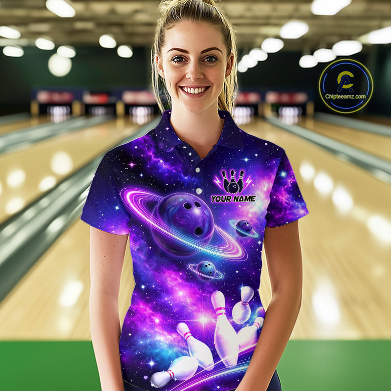 Woman wearing a purple bowling shirt with a galaxy design in a bowling alley.