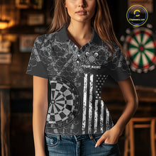 Load image into Gallery viewer, Women wearing darts polo shirt featuring dartboard graphics blended with a american flag flag pattern on a black gray background.