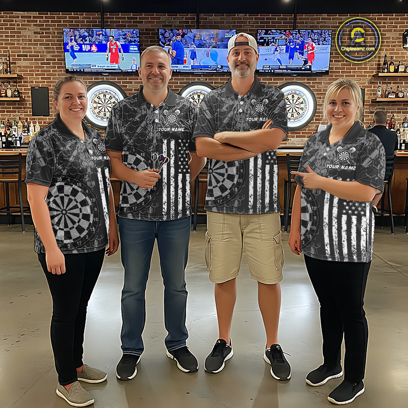 Four people wearing darts polo shirt featuring dartboard graphics blended with a american flag flag pattern on a black gray background.