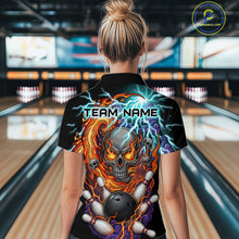 Load image into Gallery viewer, Woman wearing a black bowling polo featuring a flaming skull graphic, lightning effects, bowling pins, and a black bowling ball, with custom team name text.
