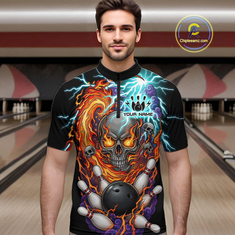 Man wearing a  black bowling quarter zip featuring a flaming skull graphic, lightning effects, bowling pins, and a black bowling ball, with custom player name text.