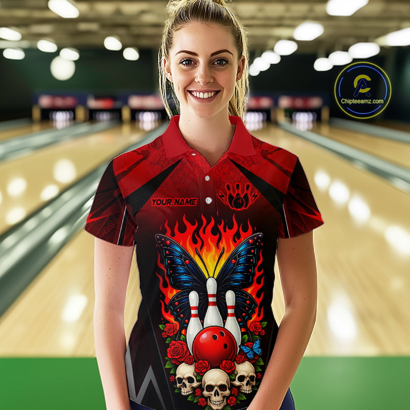 Woman wearing a red and black bowling polo shirt featuring flaming bowling pins, a red bowling ball, a blue butterfly, roses, skulls, and custom player name text.