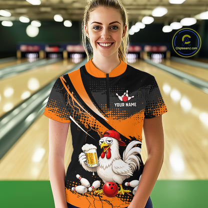 Woman wearing a orange and black bowling quarter zip featuring a chicken holding a beer mug, red bowling ball, scattered pins, and custom your name text.