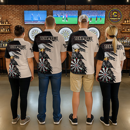 Four people wearing beige and black darts polo featuring a bald eagle, torn-flag graphics, dartboard designs, and custom team text.
