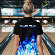 Load image into Gallery viewer, Person wearing a black bowling shirt with blue flames and 'Team Name' text in a bowling alley.
