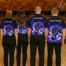 Load image into Gallery viewer, Four people wearing bowling-themed shirts with a team name on a bowling alley.