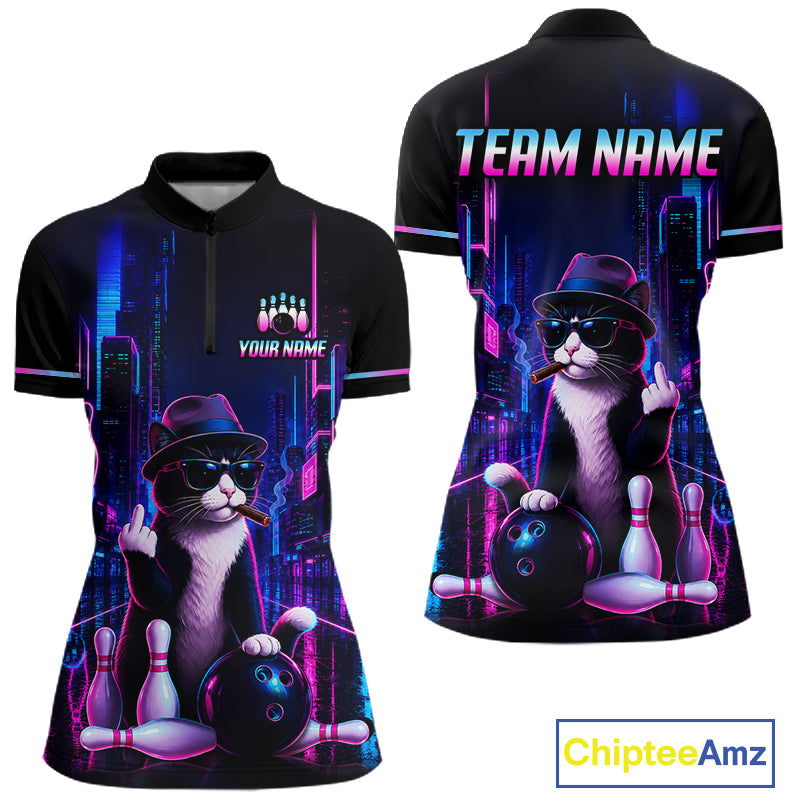 Front and back views of a black short-sleeve polo shirt with a neon cyberpunk bowling-themed graphic featuring a cat, bowling balls, pins, and glowing city lights. The front has a partial zip collar, the back has 'TEAM NAME' text, and a 'YOUR NAME' customization area.
