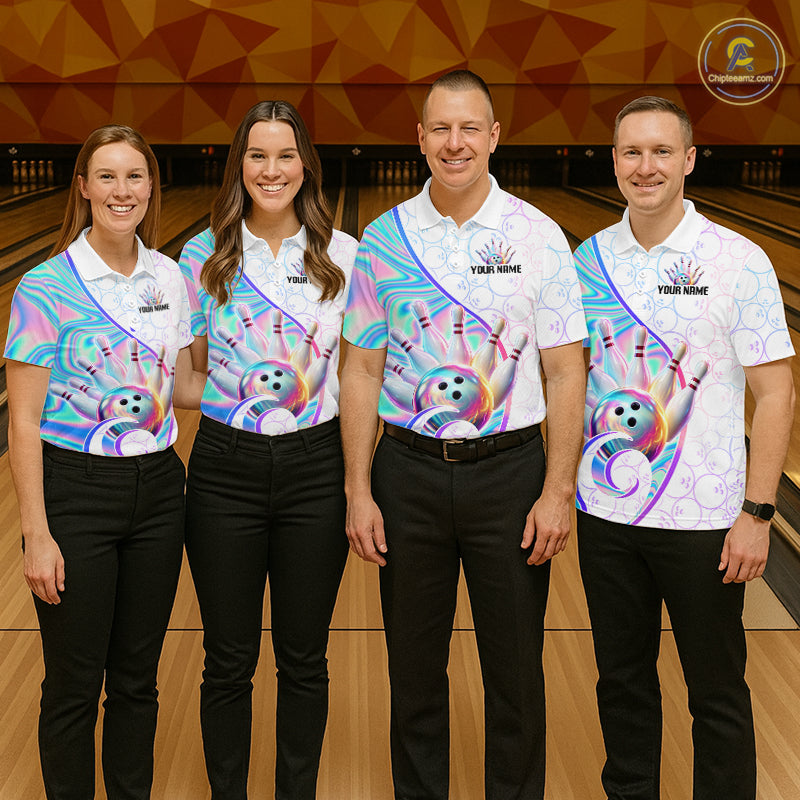 Four people standing in a bowling alley wearing matching custom bowling shirts with a colorful holographic handprint design, black pants, and 'YOUR NAME' printed on the chest. 