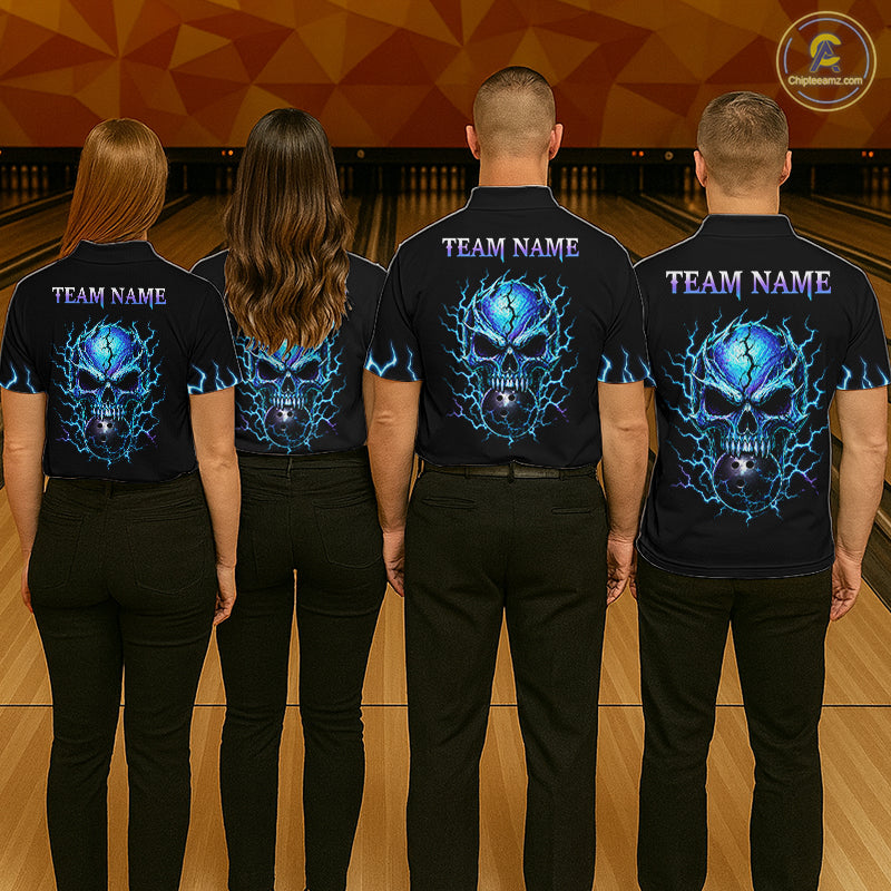 Four people standing with their backs to the camera in a bowling alley, wearing matching black short-sleeve shirts with a large blue and black skull graphic and the text 'TEAM NAME' printed across the upper back.