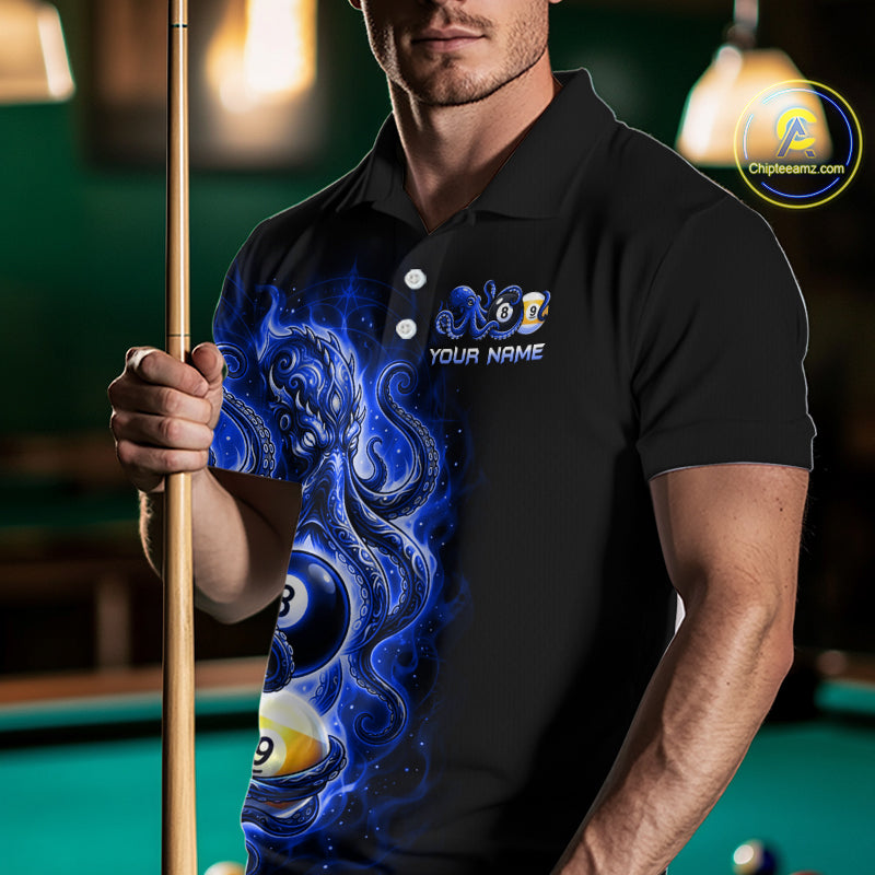 Man wearing a black polo shirt with a blue graphic design and pool cue in a billiards setting.